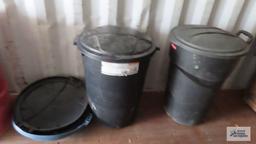 two Rubbermaid trash cans with lids