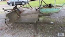 antique wooden wheelbarrow with metal wheel