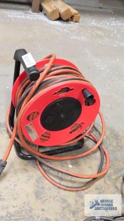 Heavy duty extension cord with freestanding reel