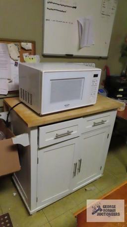 Cherry finished drop leaf table, Sharp microwave, roll...about kitchen cabinet with maple finish top