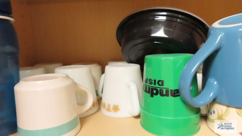 Lot of cups, glasses and dishware in three cabinets