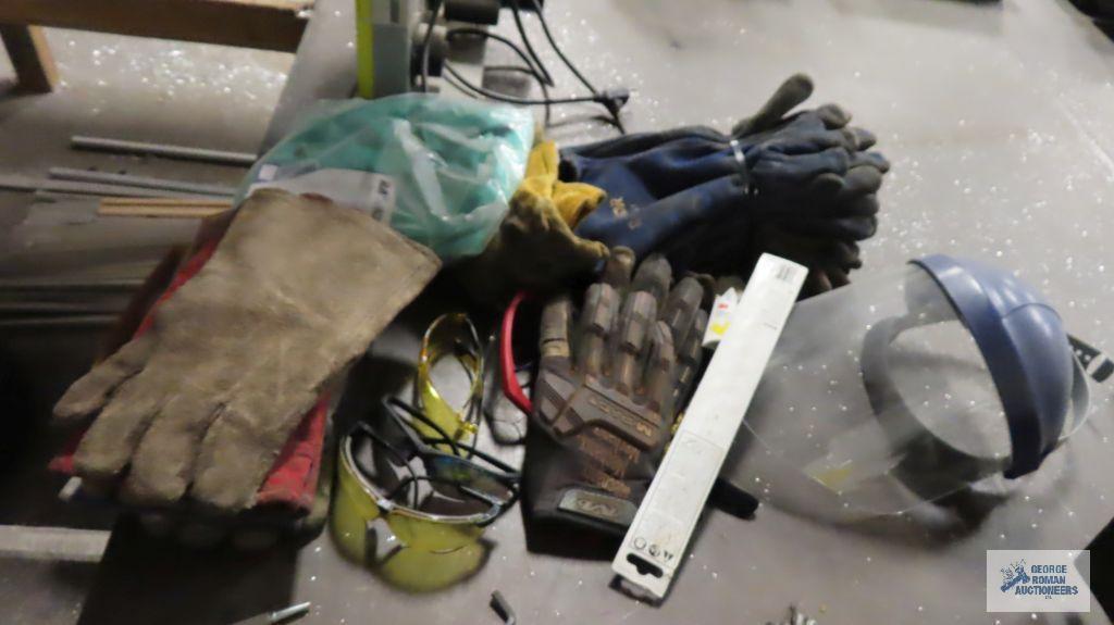 Lot of welding gloves, 30 inch welding jacket, safety glasses, etc