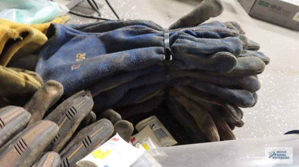 Lot of welding gloves, 30 inch welding jacket, safety glasses, etc
