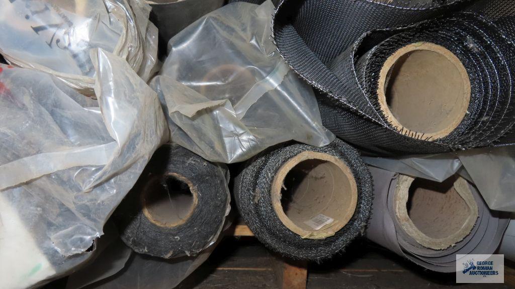 Lot of black rolls of fabric