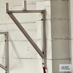 Three aluminum wall brackets with stops