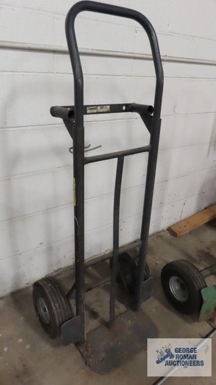Two wheel convertible dolly with pneumatic tires. Missing four wheel dolly wheels.