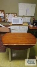 Cherry finished drop leaf table, Sharp microwave, roll...about kitchen cabinet with maple finish top