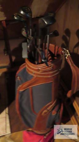 Brown golf bag with clubs