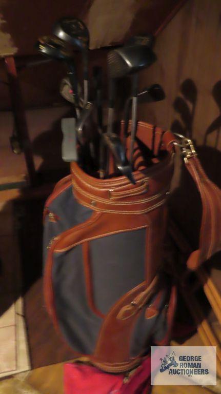 Brown golf bag with clubs