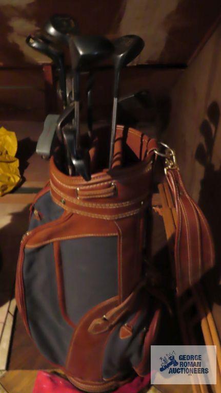 Brown golf bag with clubs