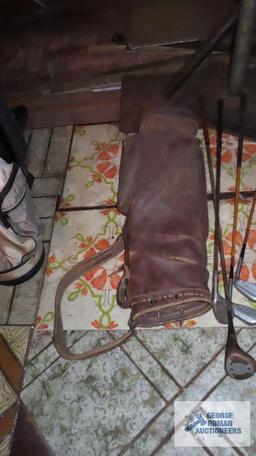 Antique leather golf bag with clubs