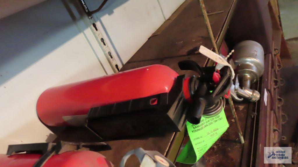 Fire extinguishers and staple gun with staples