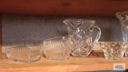 Lot of clear glassware including vases, pitchers, and etc