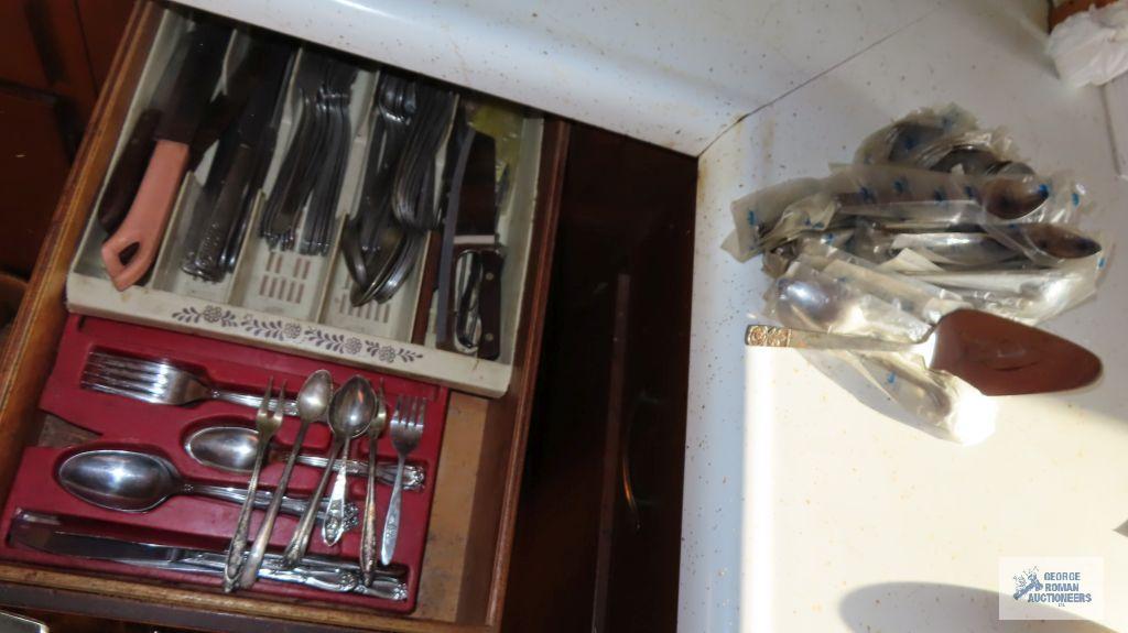 Assorted silverplate flatware and serving utensils