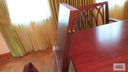 Vintage mahogany dining room table with six chairs and two extra leaves