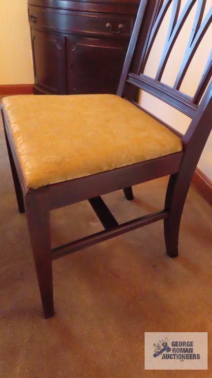 Vintage mahogany dining room table with six chairs and two extra leaves