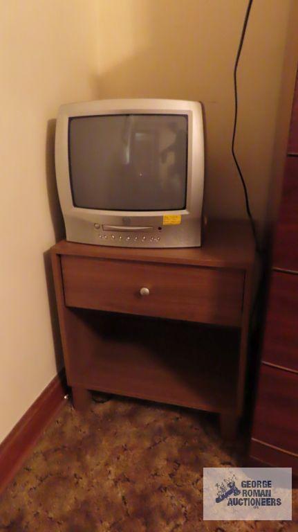 True Tech TV with built-in DVD player, Toshiba TV with built-in DVD player, and wooden nightstand