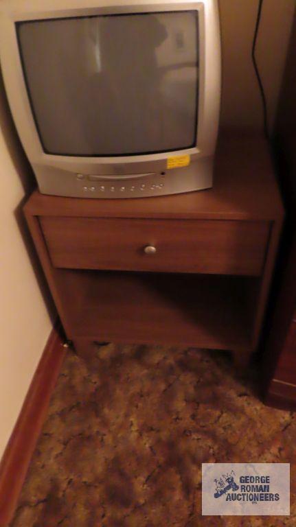 True Tech TV with built-in DVD player, Toshiba TV with built-in DVD player, and wooden nightstand