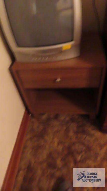 True Tech TV with built-in DVD player, Toshiba TV with built-in DVD player, and wooden nightstand