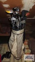 Gray golf bag with clubs