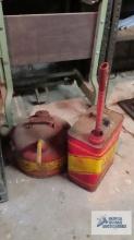 Two metal gas cans