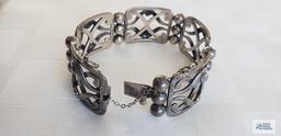 Wide silver colored bracelet, marked 925