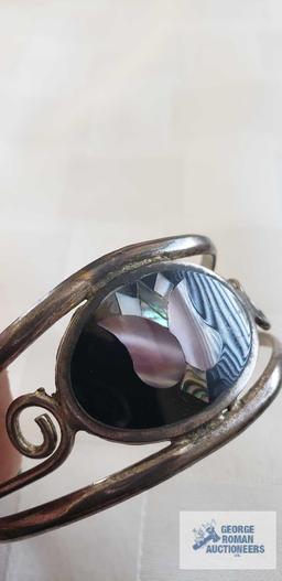 Silver colored cuff bracelet with inlaid flower, marked Mexico....Pair of earrings with turquoise