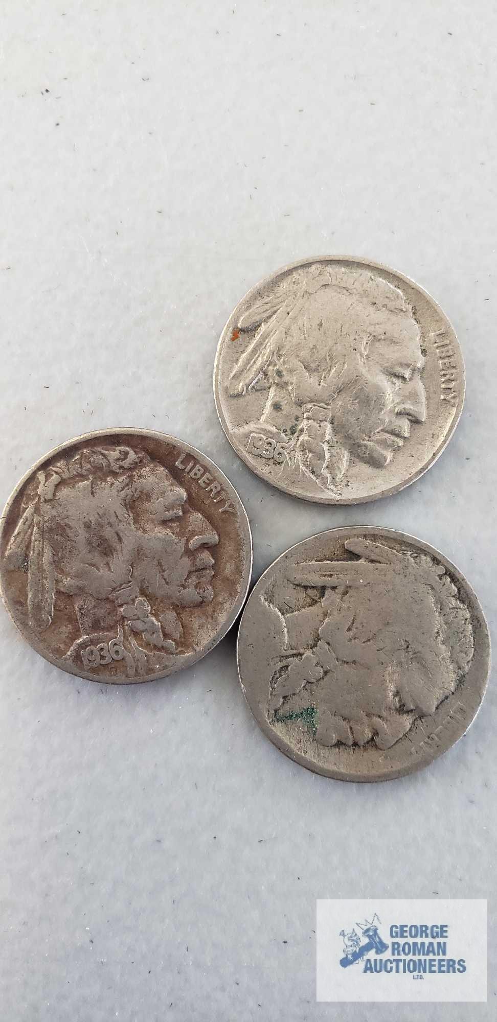 Three buffalo nickels, two indian head pennies, and one wheat penny