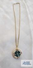 Floral painted pendant (no markings) on gold colored rope chain, marked 14K