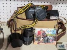 Nikon EM camera with extra lens and accessories