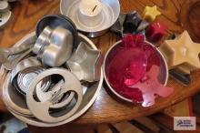 tin bakeware, cookie cutters, and candles