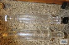 Two narrow glass bottles