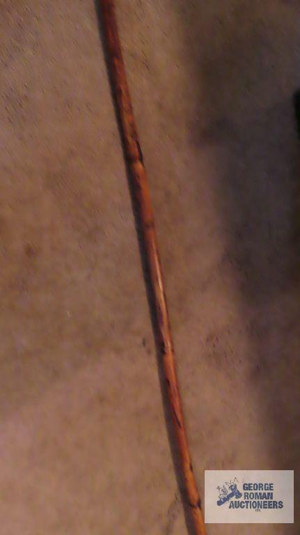 Bamboo like pole spear with hanging elements