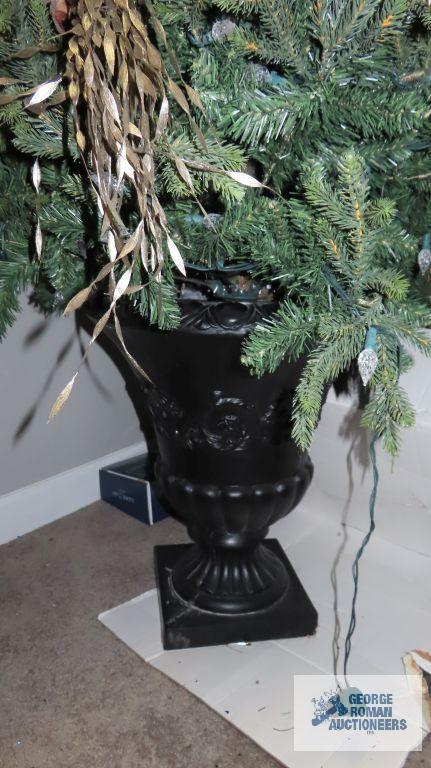 Lighted and decorated Christmas tree in planter, heavy, bring help to remove