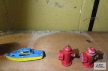 miniature cast iron fire hydrants and plastic boat