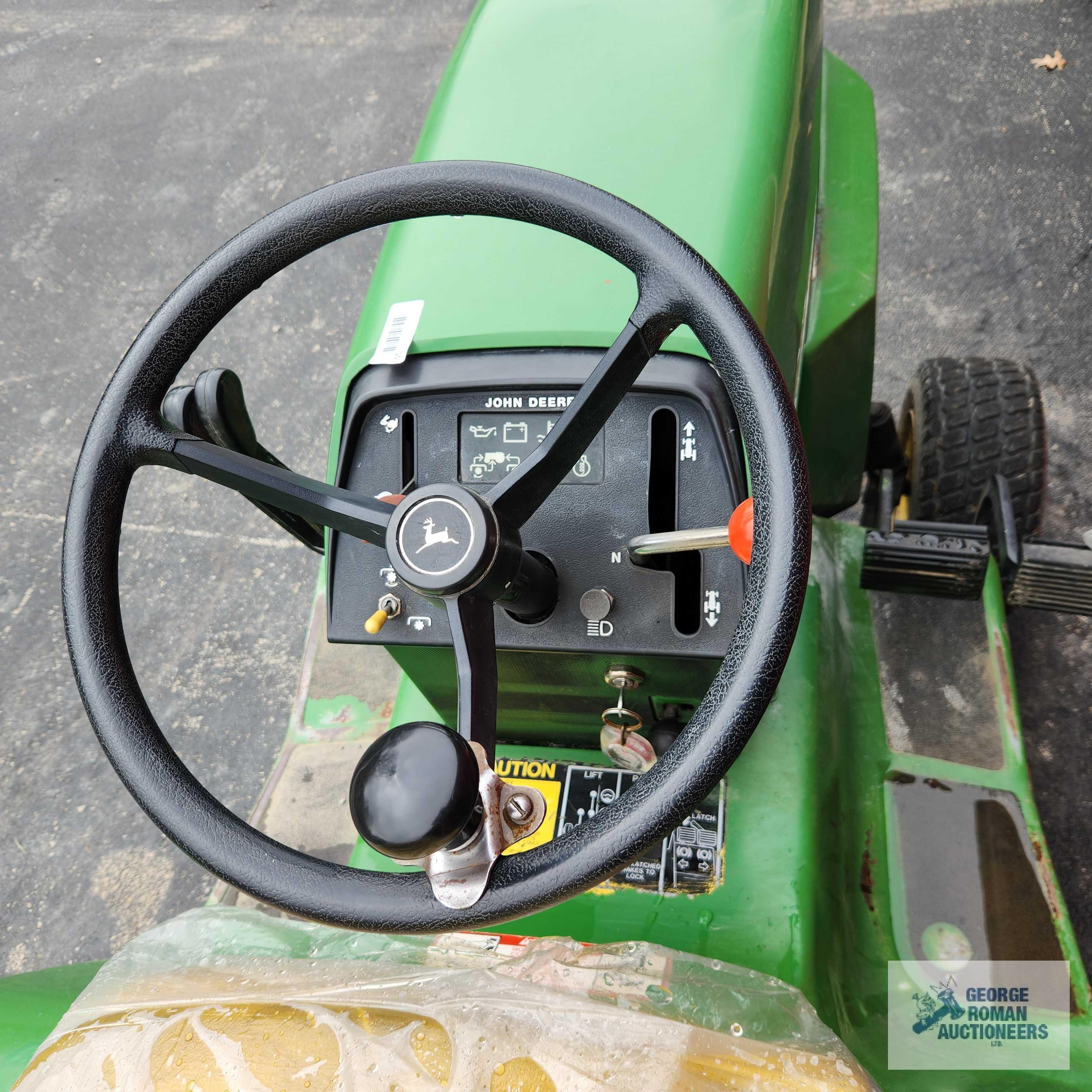 John Deere 332 diesel riding mower. 03630 hours with 52-inch deck and bagger system with blower.