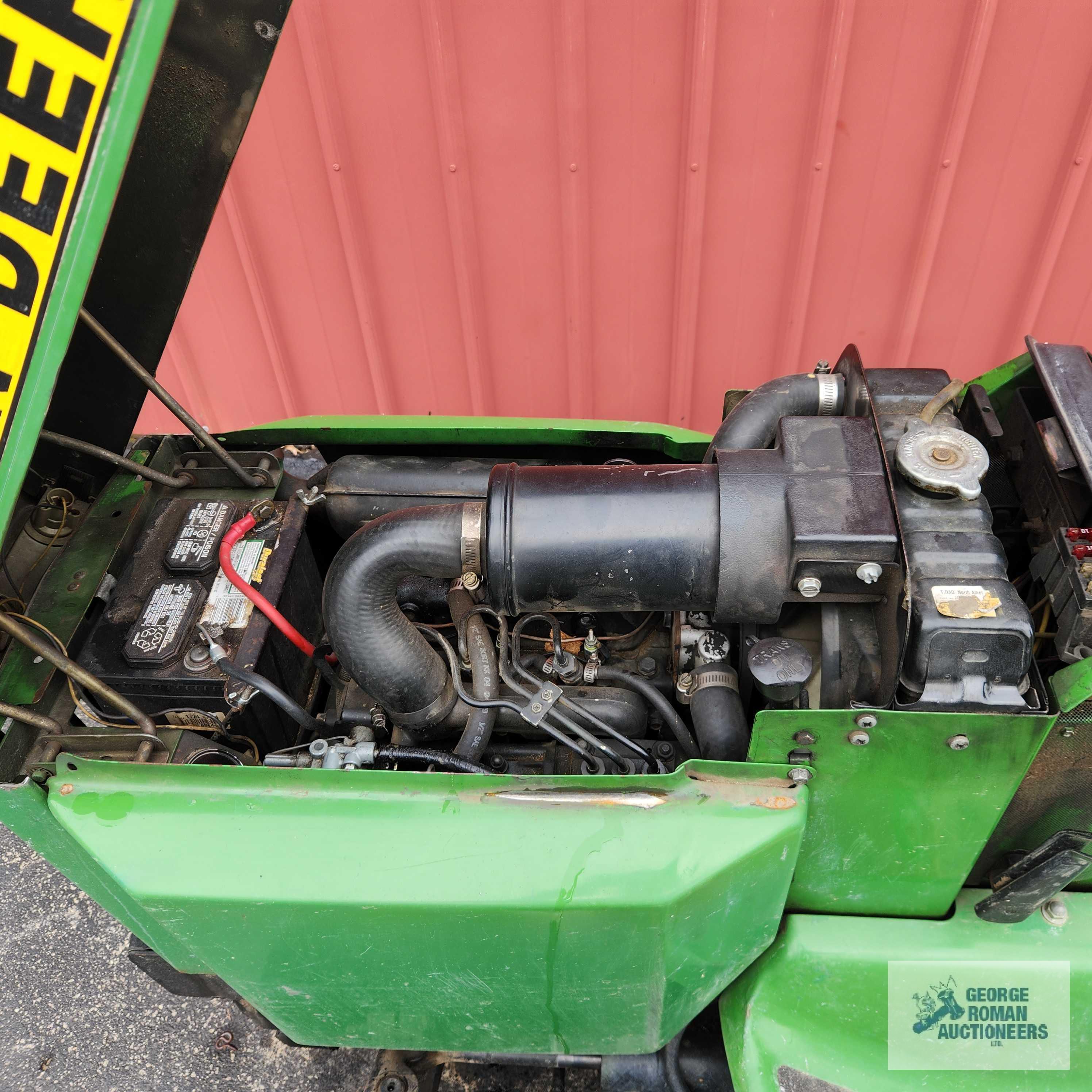 John Deere 332 diesel riding mower. 03630 hours with 52-inch deck and bagger system with blower.