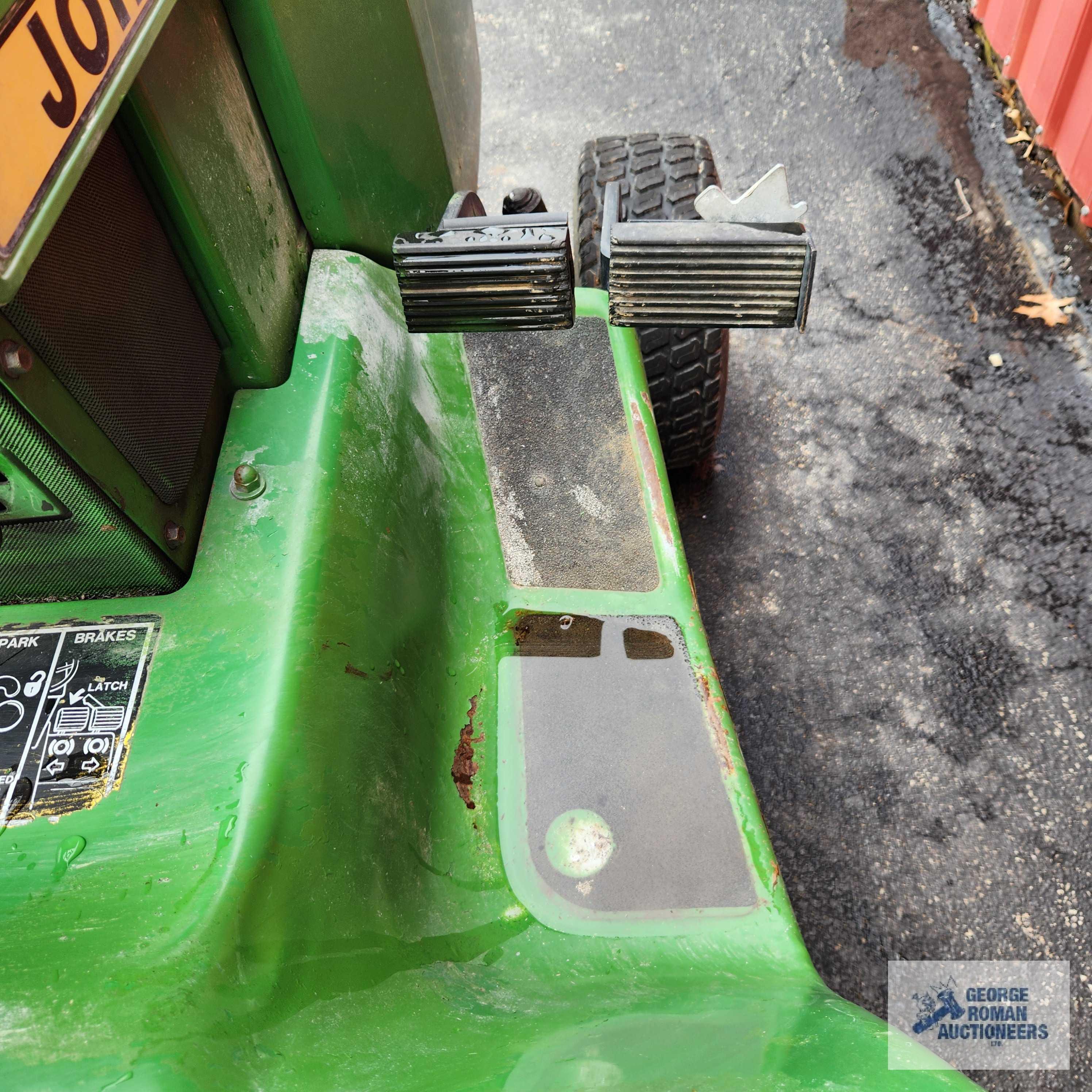 John Deere 332 diesel riding mower. 03630 hours with 52-inch deck and bagger system with blower.