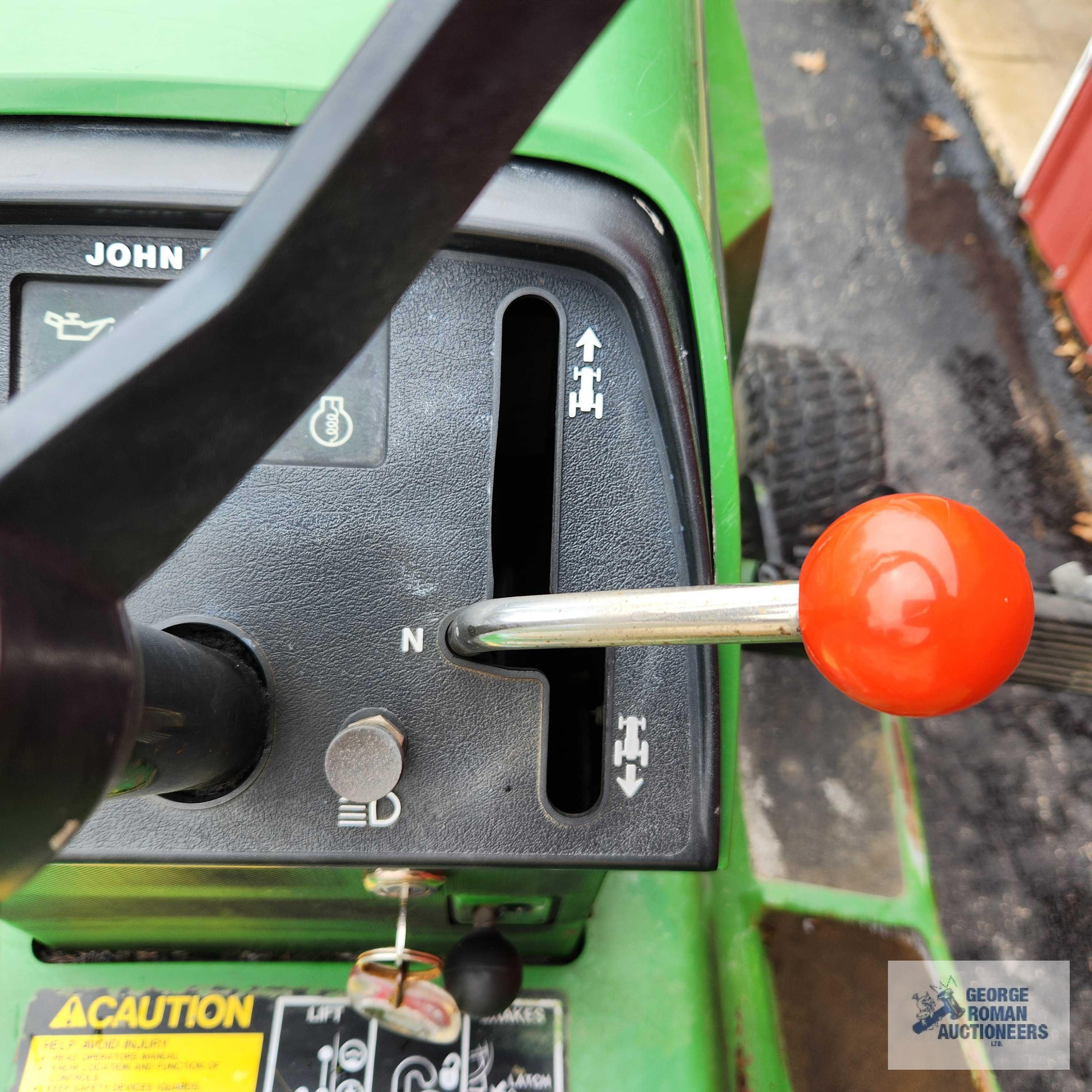 John Deere 332 diesel riding mower. 03630 hours with 52-inch deck and bagger system with blower.