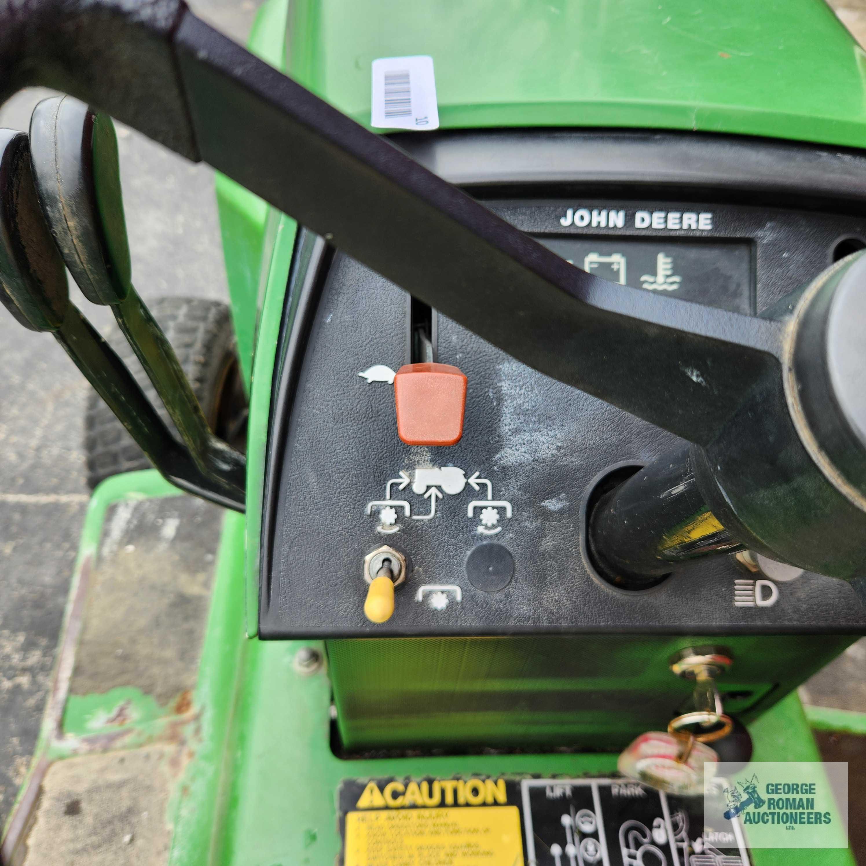 John Deere 332 diesel riding mower. 03630 hours with 52-inch deck and bagger system with blower.