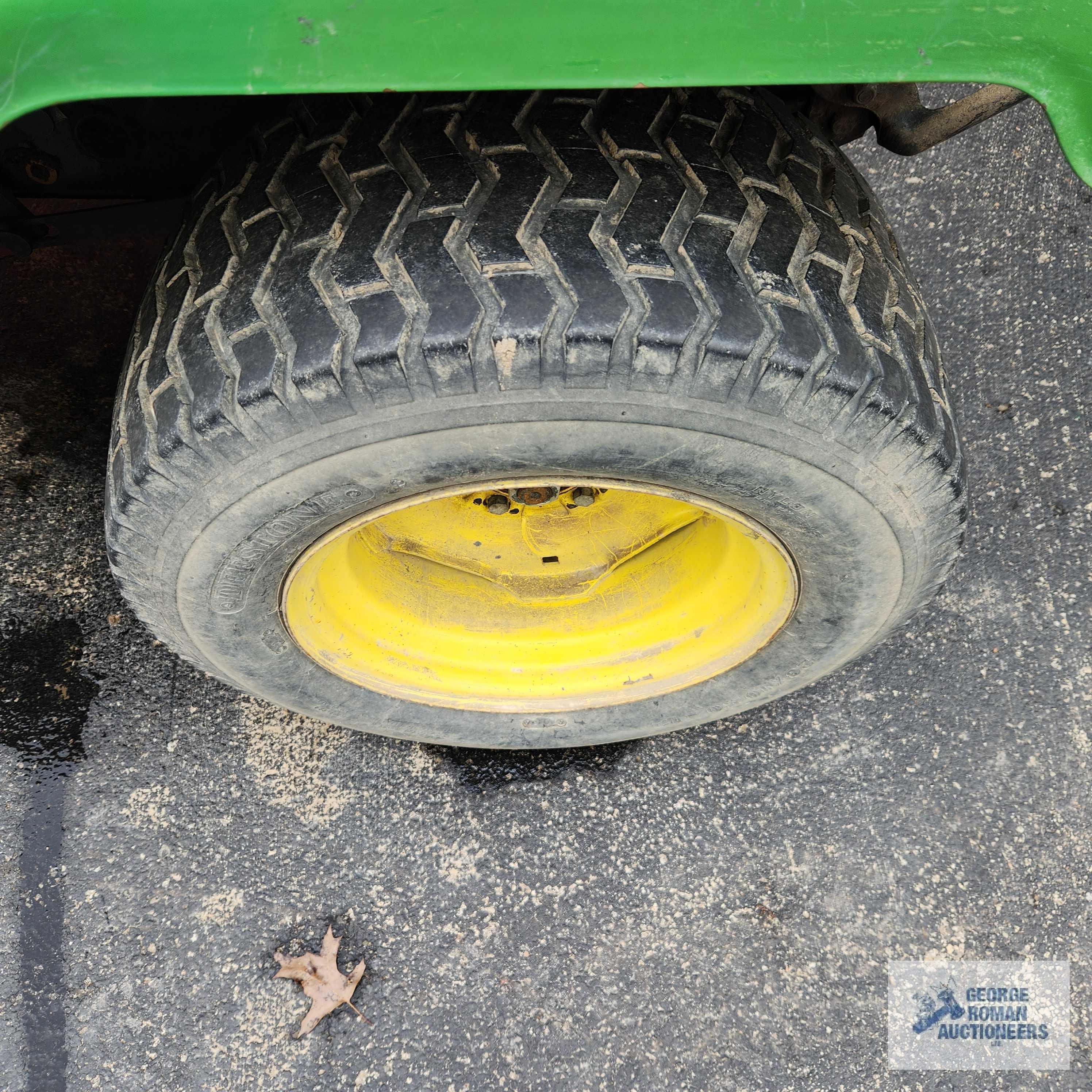 John Deere 332 diesel riding mower. 03630 hours with 52-inch deck and bagger system with blower.