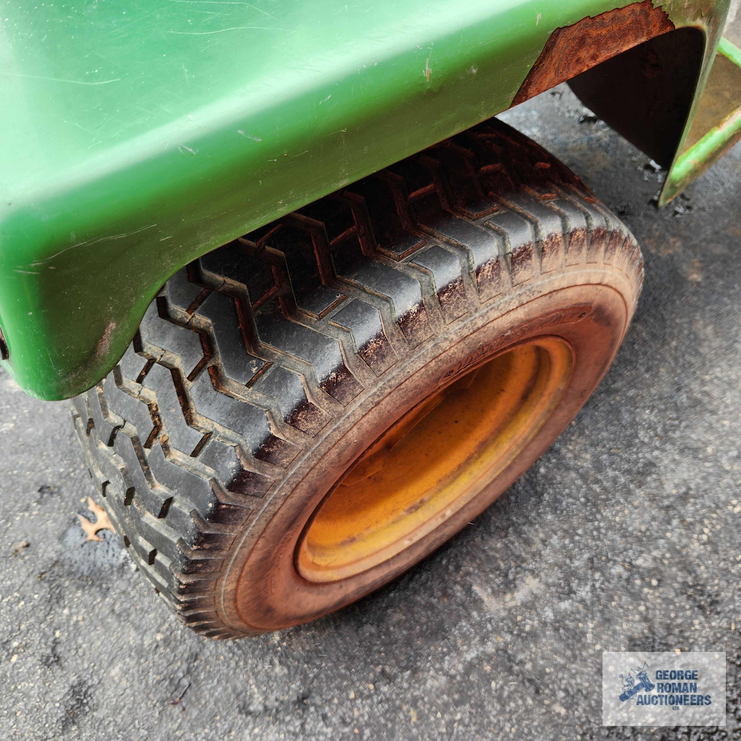 John Deere 332 diesel riding mower. 03630 hours with 52-inch deck and bagger system with blower.