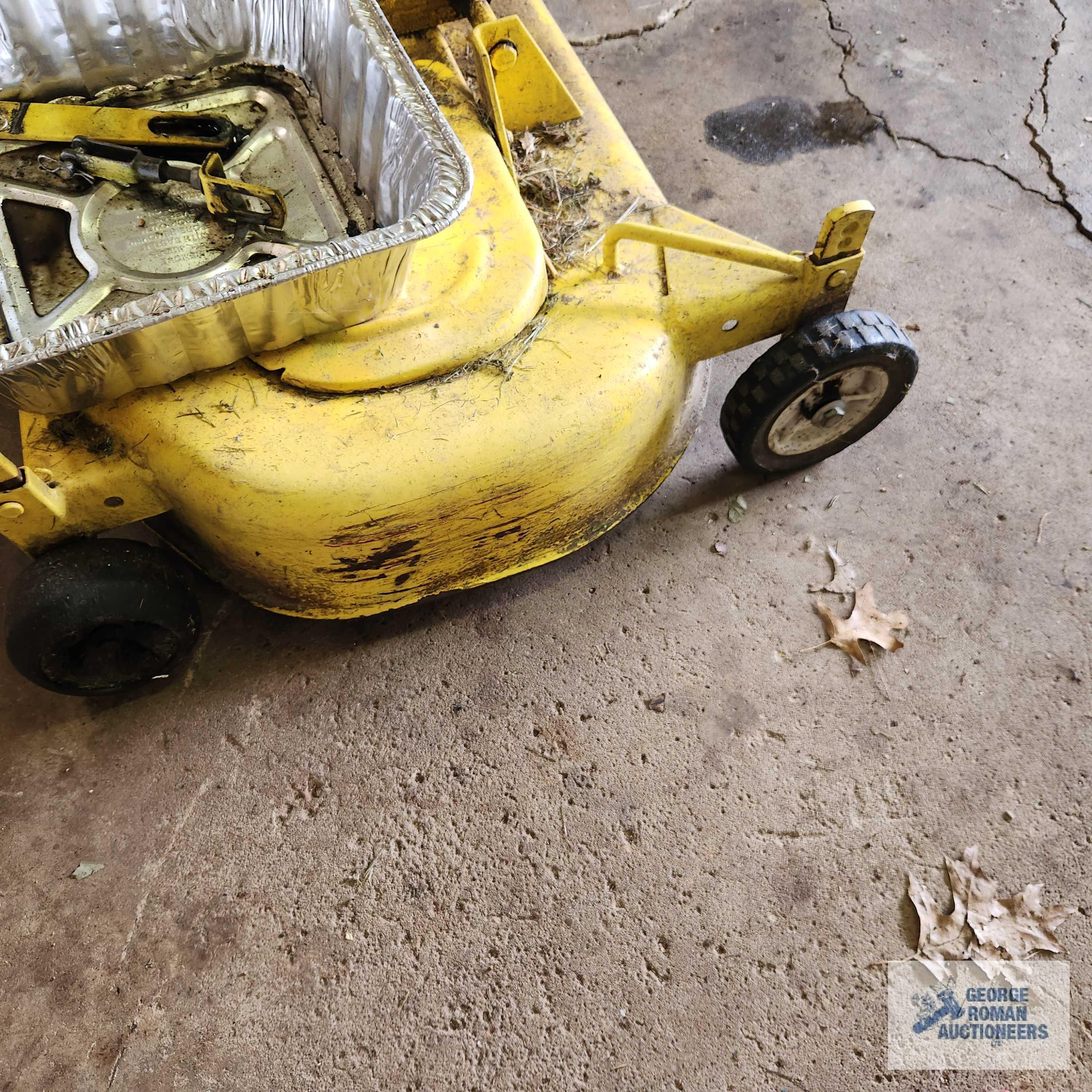 John Deere 332 diesel riding mower. 03630 hours with 52-inch deck and bagger system with blower.