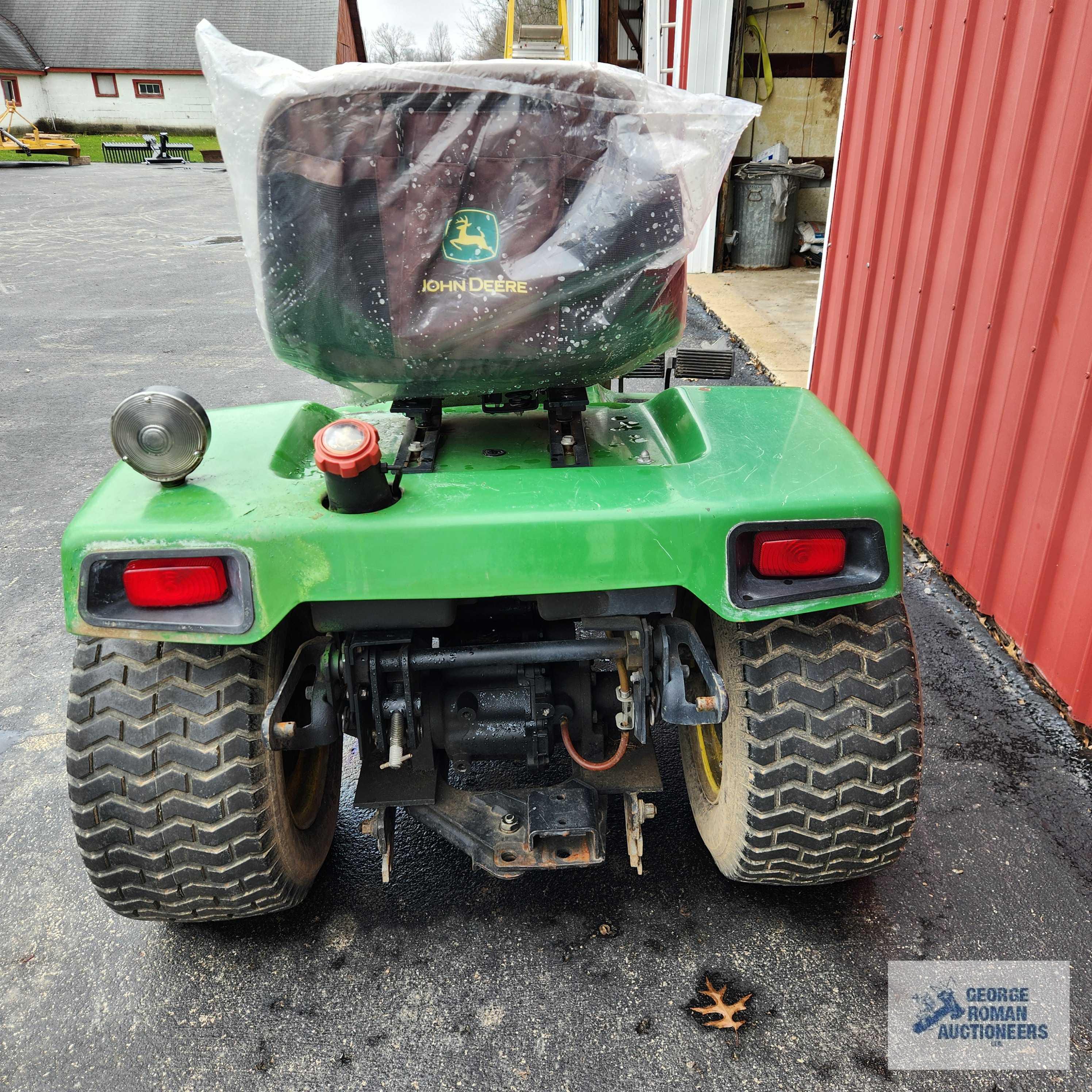 John Deere 332 diesel riding mower. 03630 hours with 52-inch deck and bagger system with blower.