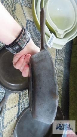 Two small cast iron skillets