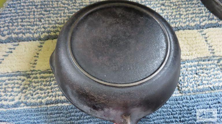 Two small cast iron skillets