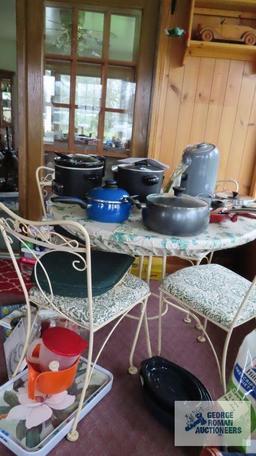 round decorative patio table and four chairs