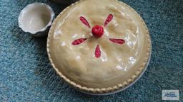 Cherry covered pie plates and decorative platters and bowl