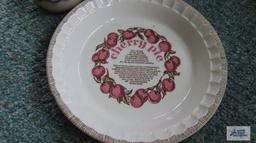 Cherry covered pie plates and decorative platters and bowl