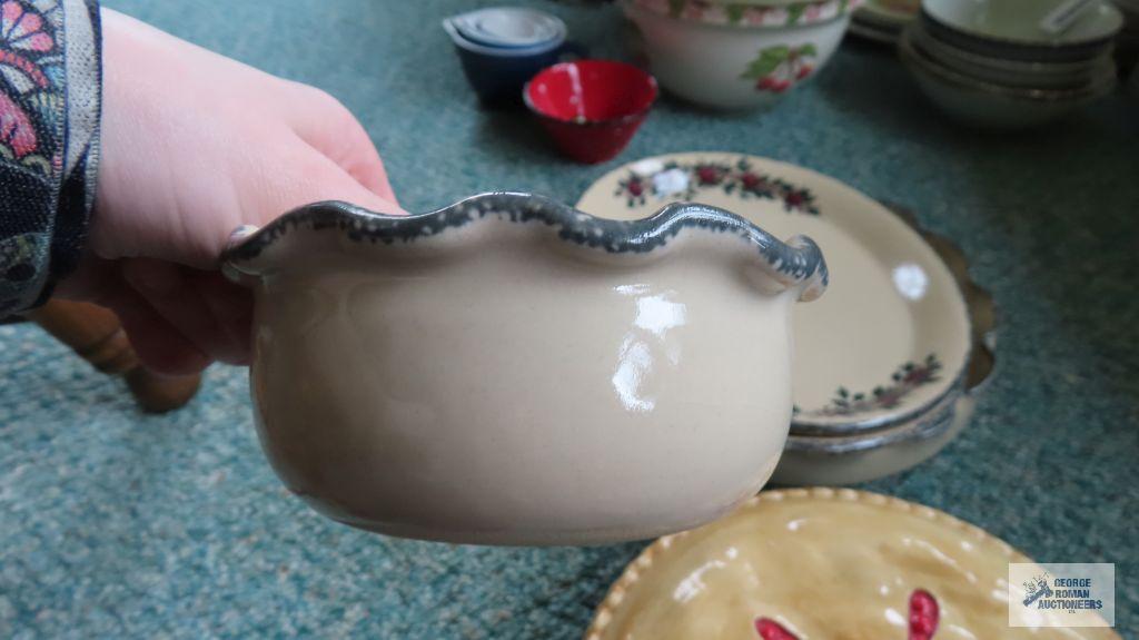 Cherry covered pie plates and decorative platters and bowl